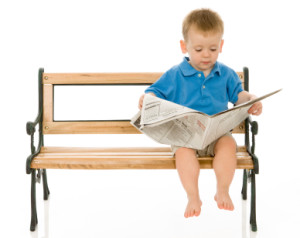Toddler Reading the Paper